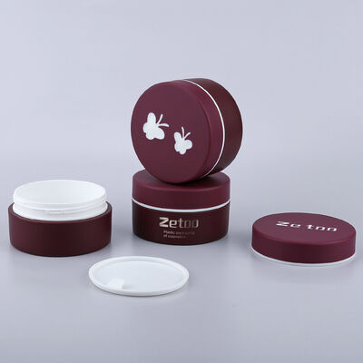Un buon prezzo. Contenitore per crema di bellezza per barattolo cosmetico di colore rosso da 100 ml in PP con confezione vuota con logo personalizzato con cappuccio a farfalla in linea